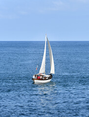 Fototapeta premium Old wooden sailboat off Santander in Spain, sailing on the Atlantic Ocean.