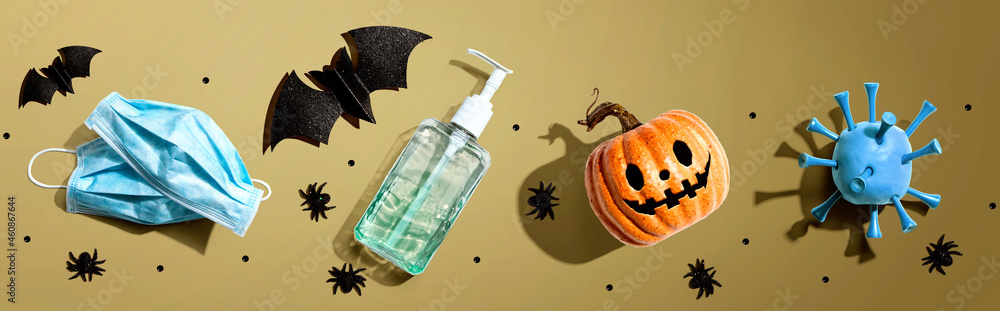 Poster masks and sanitizer bottle with halloween objects - healthcare and hygiene concept