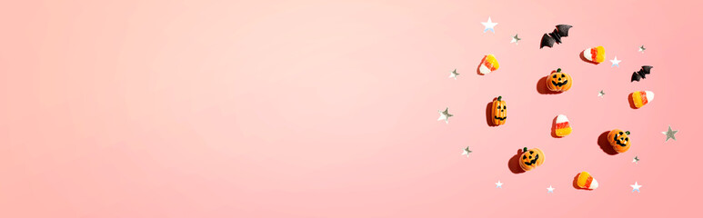 Miniature Halloween pumpkin ghosts with decorations - flat lay