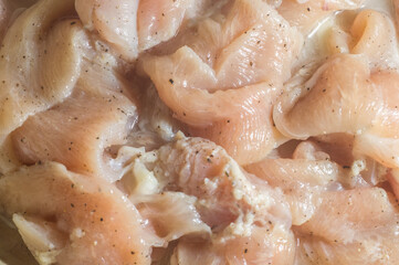 chicken fillet, texture with raw and seasoned chicken fillet