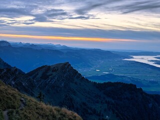 Fototapeta premium evening mood on the speer mountain in toggenburg. view to lake Zurich, Rapperswil. sunset, wanderlust, switzerland