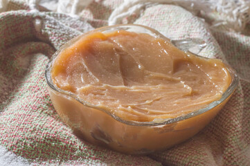 milk candy  in a bowl in a natural environment with copy space