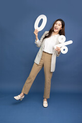 Portrait of Asian business woman standing and holding 0% number or zero percent isolated over deep blue background, Full body composition