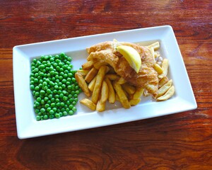Fish and chips with peas. Traditional English food pub meal