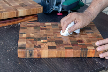 Apply the oil using a wood care swab to a food cutting board.