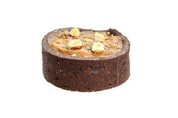 Mini caramel tart with hazelnuts isolated on white