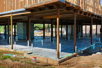 Fototapeta na wymiar PVC drain pipes in a new house in foundation slab preparation for concrete pour