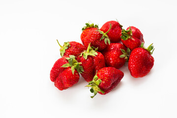 Red strawberries, arranged on a white background.