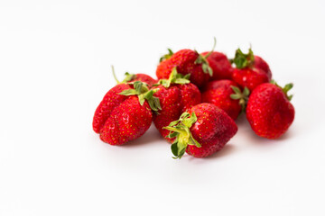 Red strawberries, arranged on a white background.