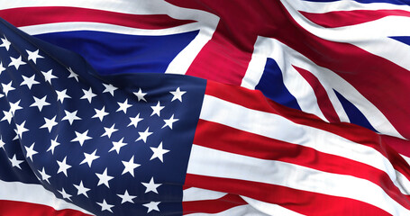 The flags of the United States and the United Kingdom waving in the wind.