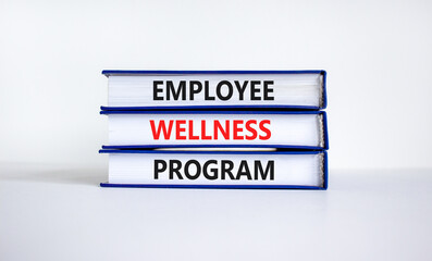 Employee wellness program symbol. Concept words 'Employee wellness program' on books. Beautiful white background. Copy space. Business and employee wellness program concept.