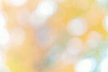 Obraz premium Abstract yellow warm colors background with bokeh defocused lights and shadow
