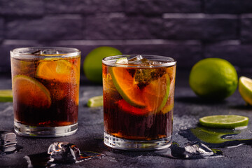 cocktail Cuba Libre with lime and ice