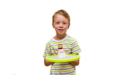 Boy holding a racket and shuttlecock on a white background. The child plays badminton. Children health sport concept