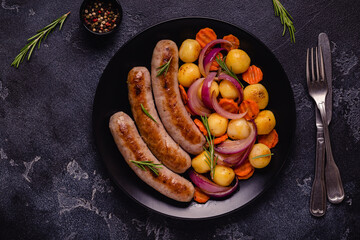 Fried sausages with vegetables.