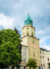Fototapeta na wymiar Trinity (Trynitarska) tower and cozy street of city Lublin, Poland, Europe