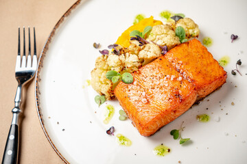 salmon steak with cauliflower and herbs
