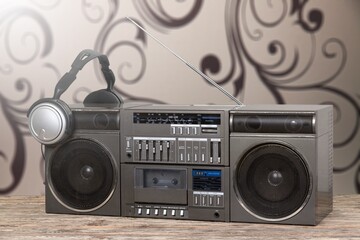 An analog stereo equalizer and a cassette stereo analog deck on the desk