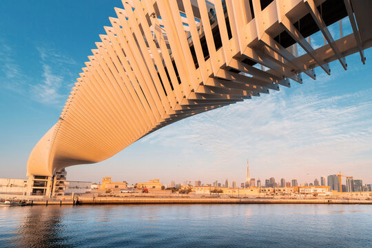 23 February 2021, UAE, Dubai:  masterpiece of modern design in architecture - the spiral pedestrian bridge over the water channel in Dubai, UAE tourist attractions