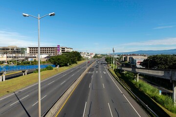 Fototapeta na wymiar San Jose, Costa Rica. August 8, 2021: Landscape with blue sky on the Próspero Fernández highway.