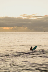 Surfer on the coast of Oahu, Hawaii