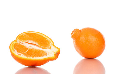 One half and one whole sweet organic minneola, close-up, isolated on white.