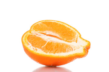 One half of sweet organic minneola, close-up, isolated on white.