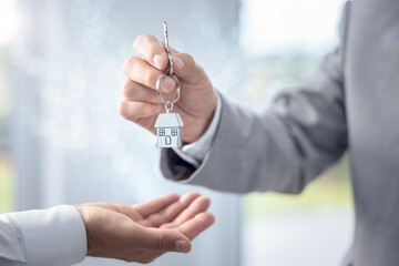 Real estate agent property realtor or landlord giving house keys
