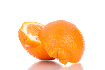 Two half organic ripe minneola, close-up, isolated on white.