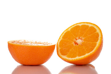 Two half organic ripe minneola, close-up, isolated on white.