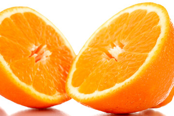 Two half organic ripe minneola, close-up, isolated on white.