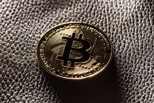 Bitcoin on leather background