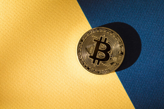 Bitcoin on yellow and blue background