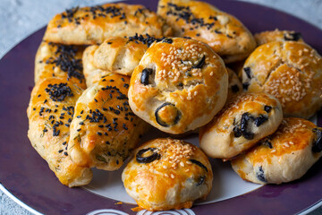 Turkish style pastry with olives and dill cheese pastry (Turkish name; Zeytinli pogaca ve dere otlu peynirli pogaca)