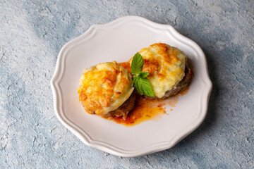 Turkish Food Hasanpasa Kofte - Kofta with Puree - Meatball with Bechamel Sauce and Green Peas. Traditional Food.