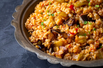 Traditional delicious Turkish food; Bulgur pilaf with eggplant and vegetables. (Turkish name;...