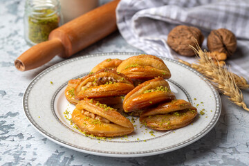 Dilberdudagi with walnut, traditional feast and ramadan dessert with syrup (Turkish name; Dilber dudagi)