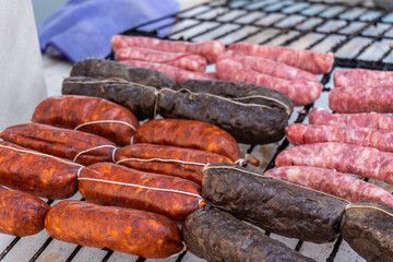 Red chorizo sausages grilled in the barbecue.