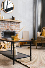 Coffee table by the fireplace of a country house in the Scandinavian style