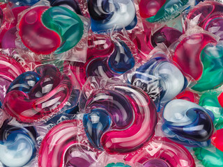 Background of gel capsules with laundry detergent