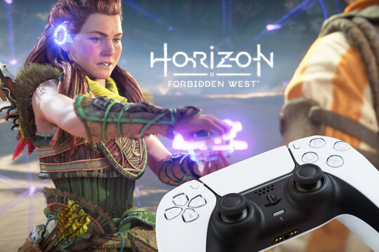 Playstation 5 Dual Sense Controller with Horizon Forbidden West 2022 game blurred in the background. Rio de Janeiro, RJ, Brazil. October 2021.