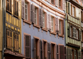 Colorful houses and wooden window shutter in Colmar, France