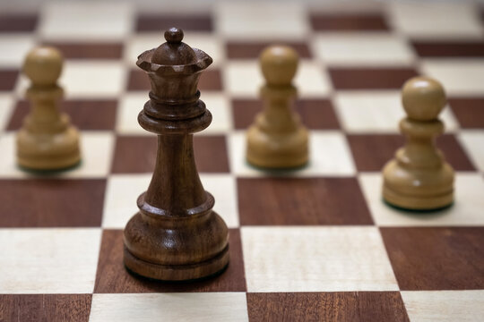 Wooden chess board with chess pieces. Checkmate