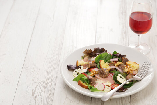 Perigord salad (duck gizzard confit, smoked duck breast, and walnuts), French cuisine