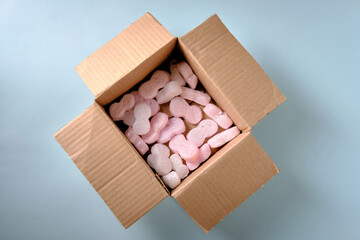 Cardboard box for gifts, top view, on a blue background