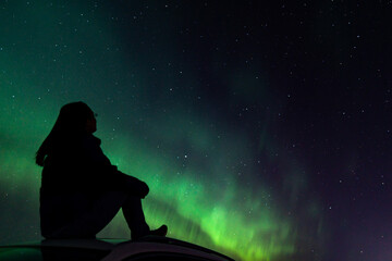 Northern Lights in Canada with Female Silhouette