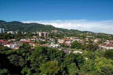 Fototapeta na wymiar Panoramic city landscape with blue sky. Escazu, San Jose, Costa Rica. 