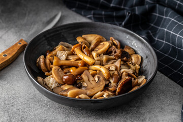 Sliced preserved mushrooms in bowl.