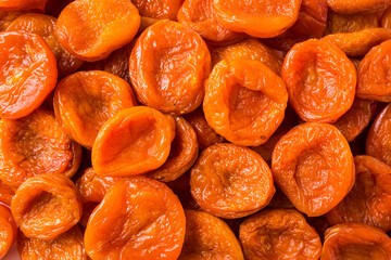 Dried apricots. Background of dried apricots. Dried fruits of close up. Top view. Background of dried fruits.