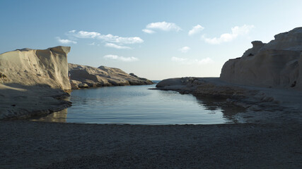 Fototapeta premium Early morning in beautiful lunar white chalk iconic bay and beach of Sarakiniko with nobody around, Milos island, Cyclades, Greece